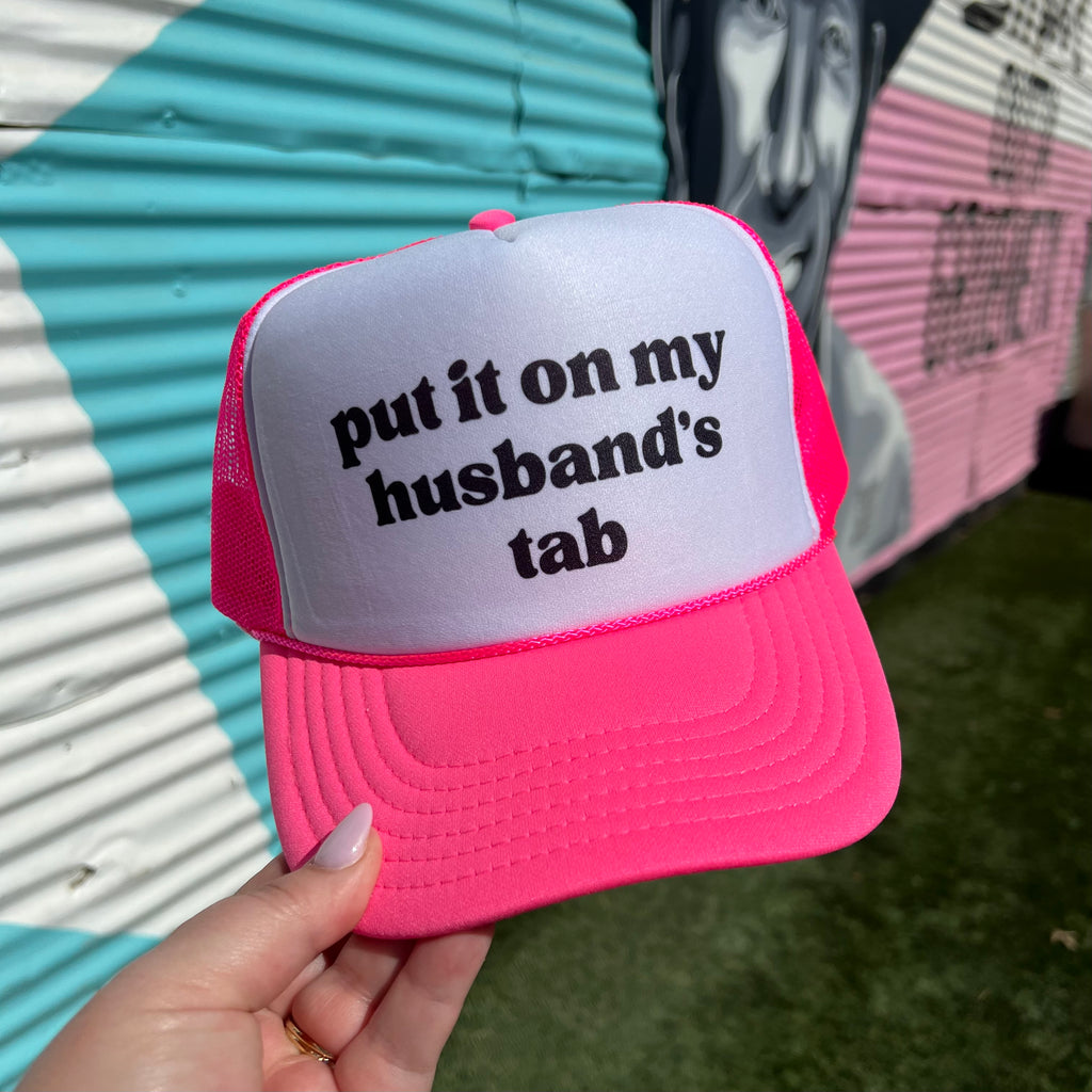 Put It On My Husband’s Tab Trucker Cap (Multiple Color Options)